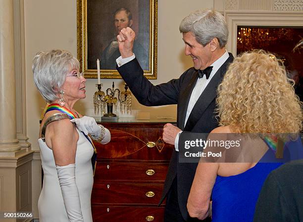 United States Secretary of State John F. Kerry, center, and singer Rita Moreno, left, one of the five recipients of the 38th Annual Kennedy Center...