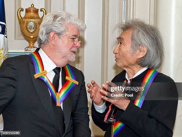 Filmmaker George Lucas, left and conductor Seiji Ozawa, right, two of the five recipients of the 38th Annual Kennedy Center Honors share a...