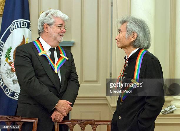 Filmmaker George Lucas, left and conductor Seiji Ozawa, right, two of the five recipients of the 38th Annual Kennedy Center Honors share a...