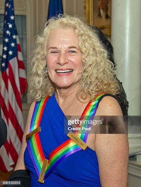 Singer-songwriter Carole King, one of the five recipients of the 38th Annual Kennedy Center Honors, smiles after posing as part of a group photo...