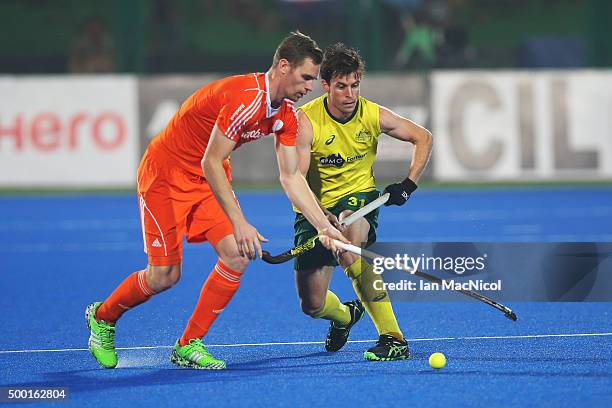 Mirco Pruijser of Netherlands vies with Fergus Kavanagh of Australia during the match between Australia and Netherlands on day eight of The Hero...