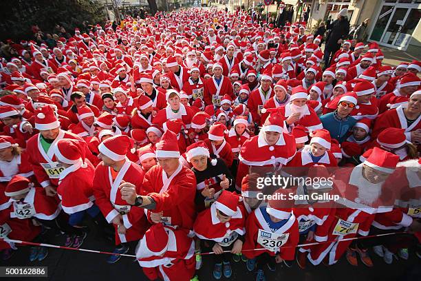 Participants dressed as Santa Claus wait to start in the 7th annual Michendorf Santa Run on December 6, 2015 in Michendorf, Germany. A record 900...