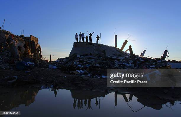 Palestinian youths practicing Parkour skills on the ruins of the houses that were destroyed during the Israeli attack at the east of Khan Yunis in...