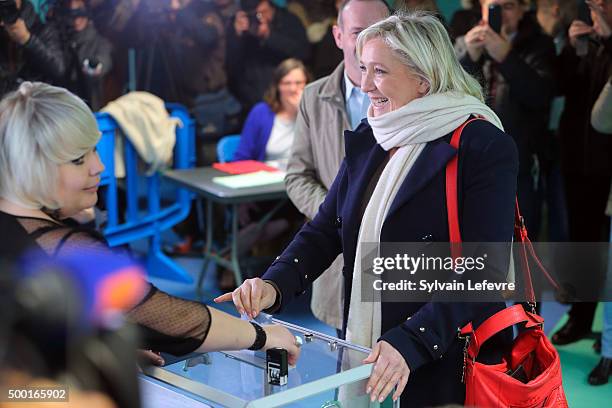 French Far-Right National Front President Marine Le Pen prepares to vote in for the first round of regional elections, on December 6, 2015 in...