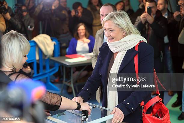 French Far-Right National Front President Marine Le Pen prepares to vote in for the first round of regional elections, on December 6, 2015 in...