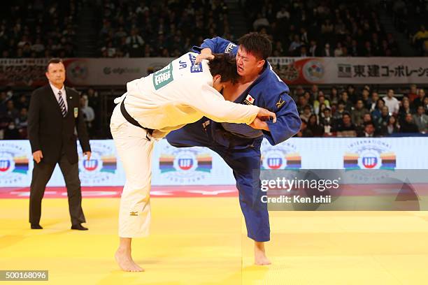 Hisayoshi Harasawa of Japan throws Ryu Shichinohe of Japan in the Men' +100kg final at Tokyo Metropolitan Gymnasium on December 6, 2015 in Tokyo,...