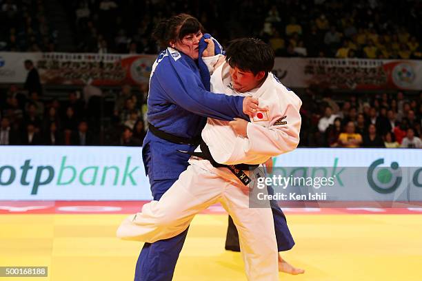 Wakaba Tomita of Japan throws Iryna Kindzerska of Ukraine in the Women' +78kg bronze medal match at Tokyo Metropolitan Gymnasium on December 6, 2015...