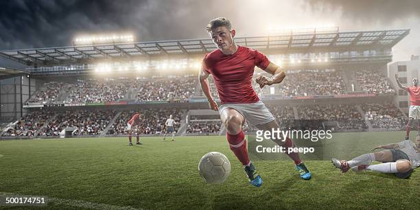 soccer player - fußballspieler stock-fotos und bilder