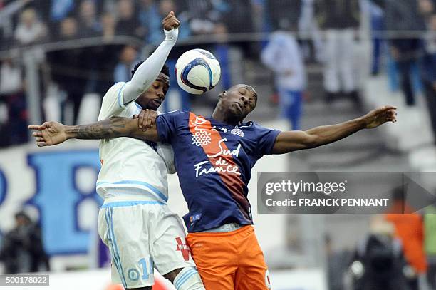 Marseille's French midfielder Georges-Kévin Nkoudou vies with Montpelliers French midfielder Bryan Dabo during the French L1 football match Olympique...