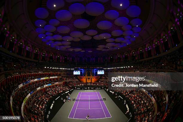 John McEnroe of the USA serves during his Legends Exhibition singles match against Henri Leconte of France during day five of the Masters Tennis at...