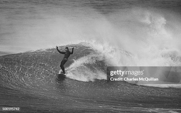 Pro surfer Alastair Mennie catches a barrelled wave during Storm Desmond at Whiterocks beach on December 6, 2015 in Portrush, Northern Ireland. Storm...