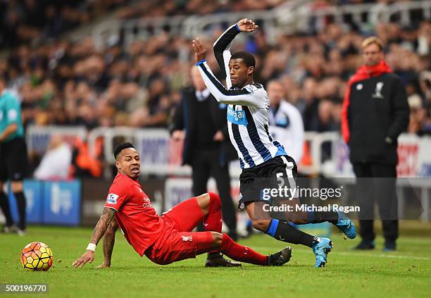 Georginio Wijnaldum of Newcastle United skips past Nathaniel Clyne of Liverpool during the Barclays Premier League match between Newcastle United and...