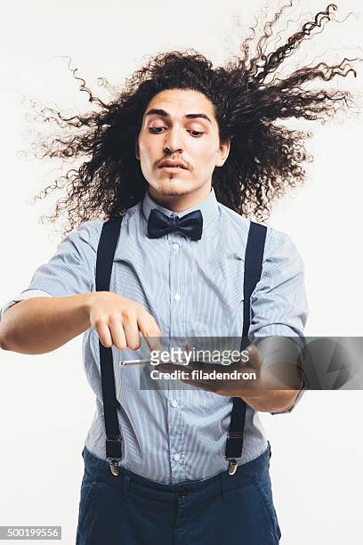 fast internet - tousled hair man stock pictures, royalty-free photos & images