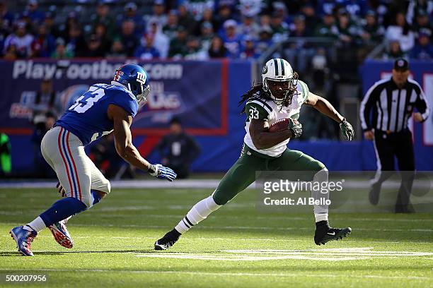 Chris Ivory of the New York Jets runs with the ball against Jasper Brinkley of the New York Giants at MetLife Stadium on December 6, 2015 in East...