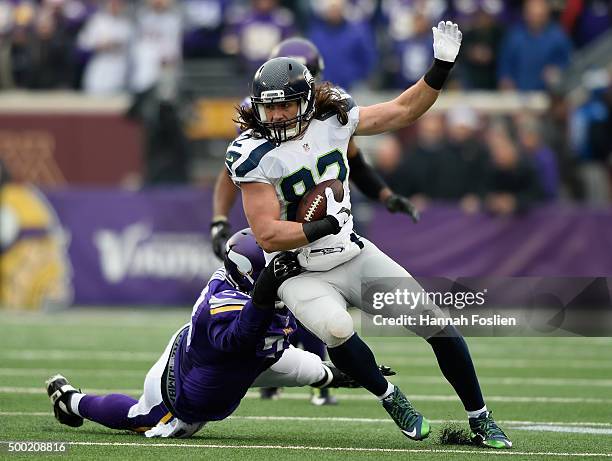 Luke Willson of the Seattle Seahawks avoids a tackle by Sharrif Floyd of the Minnesota Vikings during the first quarter of the game on December 6,...