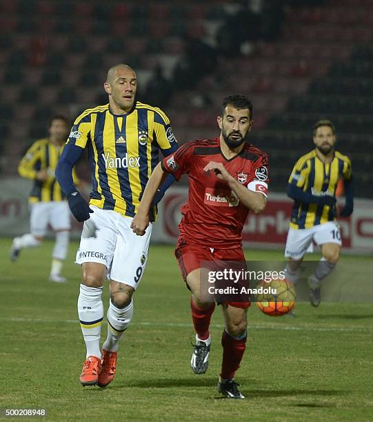 Fernandao of Fenerbahce in action against Elyasa Sume of Gaziantep during Turkish Spor Toto Super Lig match between Gaziantepspor and Fenerbahce at...