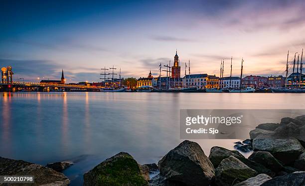 city of kampen at the river ijssel during a sunset - kampen overijssel stock pictures, royalty-free photos & images