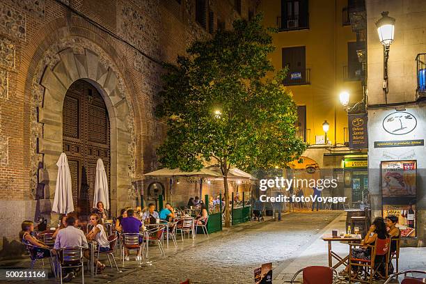 madrid people relaxing at outdoor restaurant bars warm night spain - madrid plaza stock pictures, royalty-free photos & images
