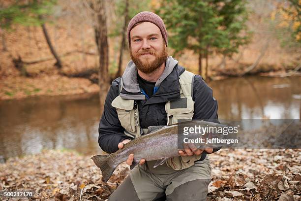guess who's eating fish tonight! - man catching stock pictures, royalty-free photos & images