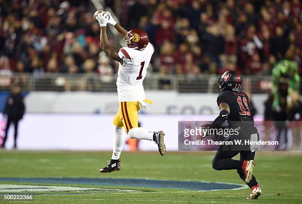 Darreus Rogers of the USC Trojans catches a pass in front of Terrence Alexander of the Stanford Cardinal during the third quarter of the NCAA Pac-12...