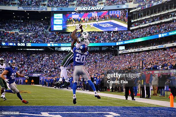 Brandon Marshall of the New York Jets catches a touchdown late in the game against Prince Amukamara of the New York Giants at MetLife Stadium on...