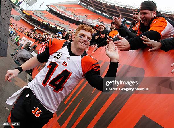 Andy Dalton of the Cincinnati Bengals celebrates a 37-3 win over the Cleveland Browns with fans at FirstEnergy Stadium on December 6, 2015 in...