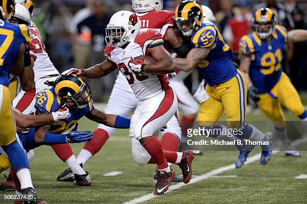 Stepfan Taylor of the Arizona Cardinals carries the ball in the fourth quarter against the St. Louis Rams at the Edward Jones Dome on December 6,...