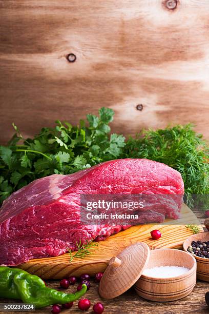 raw beef meat - wooden shield stock pictures, royalty-free photos & images