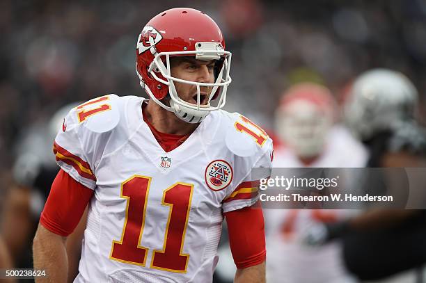 Alex Smith of the Kansas City Chiefs celebrates after a three-yard touchdown against the Oakland Raiders during their NFL game at O.co Coliseum on...