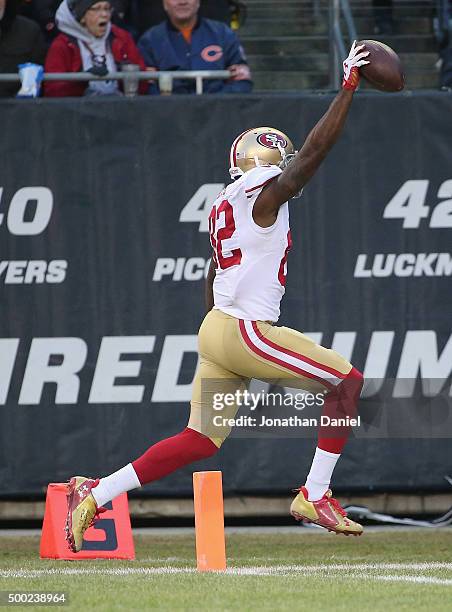 Torrey Smith of the San Francisco 49ers crosses the goalline to score the winning touchdown against the Chicago Bears at Soldier Field on December 6,...