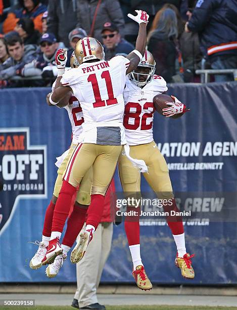 Shaun Draughn, Quinton Patton and Torrey Smith of the San Francisco 49ers leap in celebration after Smith caught the game-winning touchdown pass...