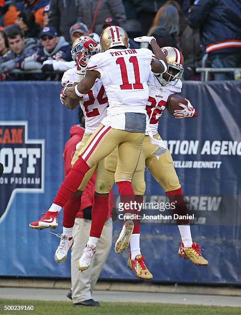 Shaun Draughn, Quinton Patton and Torrey Smith of the San Francisco 49ers leap in celebration after Smith caught the game-winning touchdown pass...