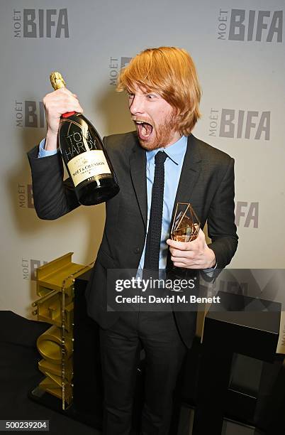 Domhnall Gleeson, accepting the Best Actor award on behalf of Tom Hardy for "Legend", poses at the Moet British Independent Film Awards 2015 at Old...