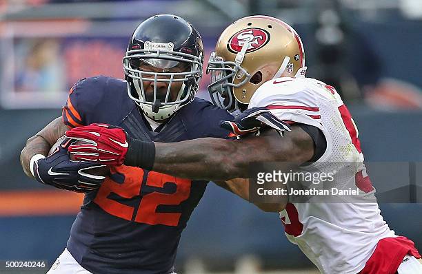 Matt Forte of the Chicago Bears is hit by NaVorro Bowman of the San Francisco 49ers at Soldier Field on December 6, 2015 in Chicago, Illinois. The...