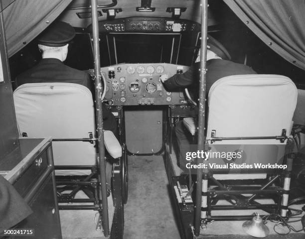 View of the bridge of the Atlantic Clipper, where the pilot stations have two pilot officers who handle the flying controls of the Clipper, Port...
