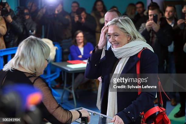 French Far-Right National Front President Marine Le Pen prepares to vote in for the first round of regional elections, on December 6, 2015 in...