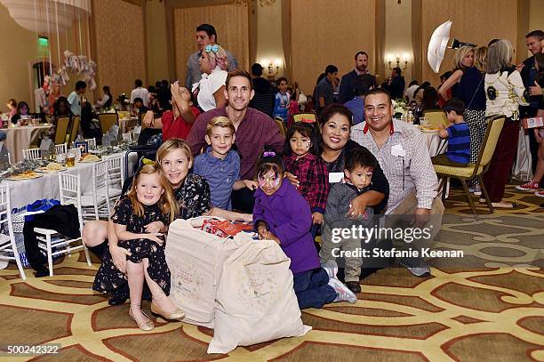 Christopher Gavigan, actress Jessica Capshaw and guests attend the Baby2Baby Holiday Party Presented By Tiny Prints At Montage Beverly Hills on...