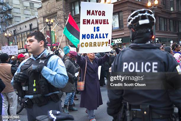 Demonstrators led by Rev. Jesse Jackson march down State Street to protest the death of Laquan McDonald and the alleged cover-up that followed on...