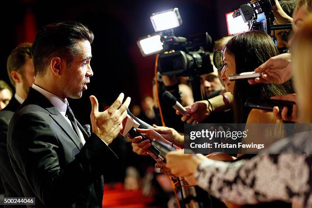 Actor Colin Farrell talks to reporters as he arrives at The Moet British Independent Film Awards 2015 at Old Billingsgate Market on December 6, 2015...