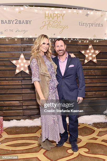 Model Molly Sims and CEO of Shutterfly Inc Jeffrey Housenbold attend the Baby2Baby Holiday Party Presented By Tiny Prints At Montage Beverly Hills on...