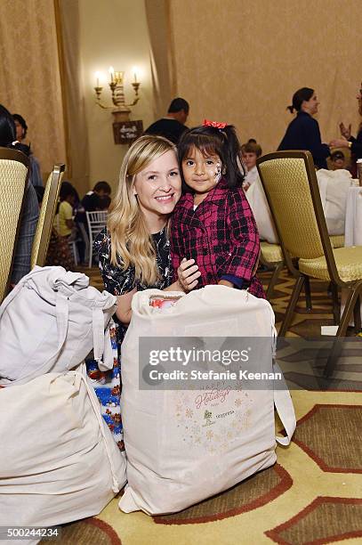 Actress Jessica Capshaw and guest attend the Baby2Baby Holiday Party Presented By Tiny Prints At Montage Beverly Hills on December 6, 2015 in Beverly...