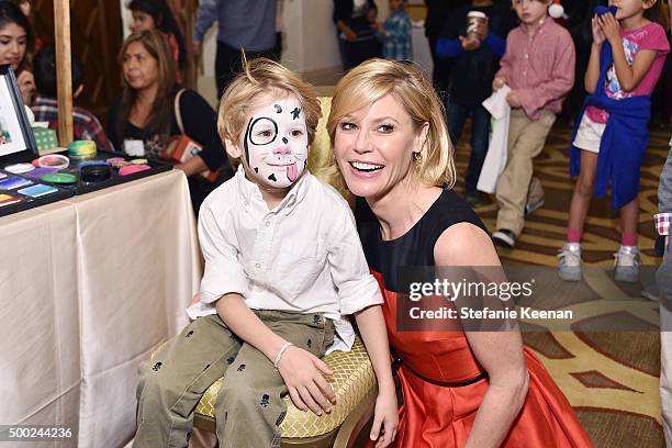 Actress Julie Bowen and son attend the Baby2Baby Holiday Party Presented By Tiny Prints At Montage Beverly Hills on December 6, 2015 in Beverly...