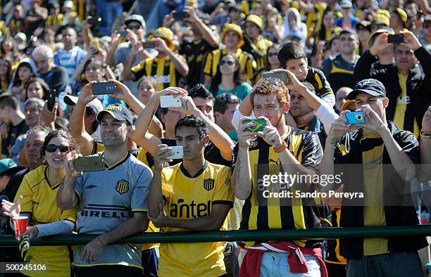 Fans of Penarol take pictures during a match between Penarol and Juventud as part of Torneo Apertura 2015 at Centenario Stadium on December 06, 2015...