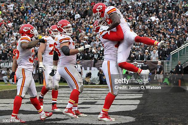 Jeremy Maclin of the Kansas City Chiefs celebrates with Jah Reid after a 13-yard touchdown pass from Alex Smith during their NFL game against the...
