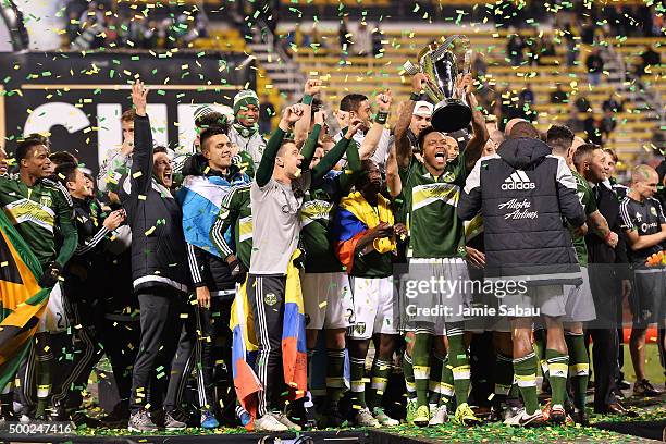 The Portland Timbers celebrate with the MLS Cup trophy on December 6, 2015 at MAPFRE Stadium in Columbus, Ohio. Portland defeated Columbus Crew SC...