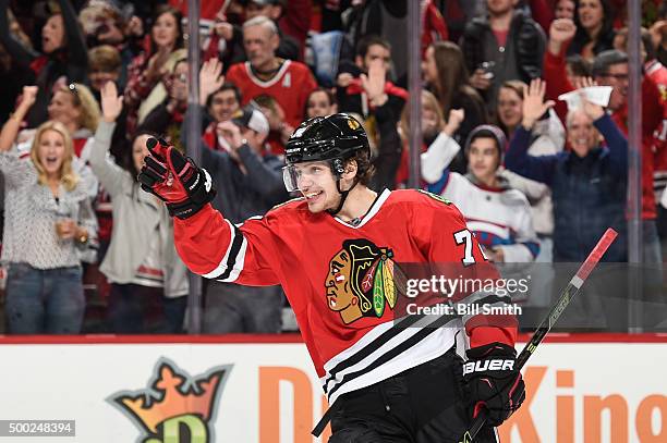 Artemi Panarin of the Chicago Blackhawks reacts after scoring an empty-net goal against the Winnipeg Jets in the third period of the NHL game at the...