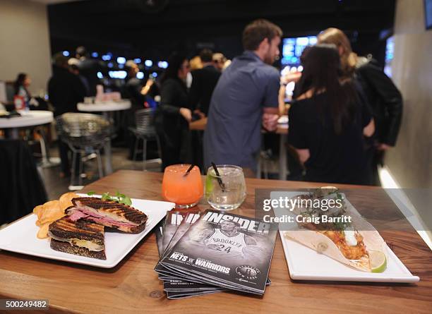 American Express Card Members enjoy the Nets vs. Warriors game at Barclays Center in the Centurion Suite Sunday night on December 6, 2015 in New York...