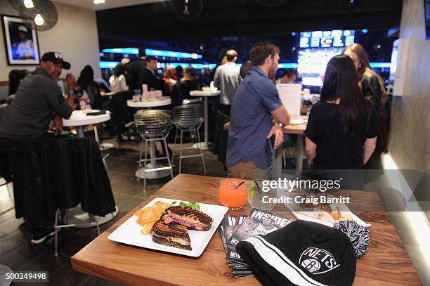 American Express Card Members enjoy the Nets vs. Warriors game at Barclays Center in the Centurion Suite Sunday night on December 6, 2015 in New York...