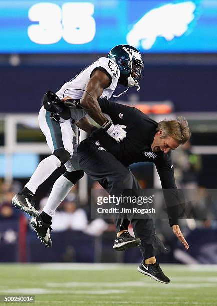Malcolm Jenkins of the Philadelphia Eagles celebrates with defensive backs coach Cory Undlin after an incomplete New England Patriots pass leading to...