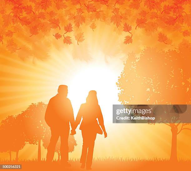 heterosexual couple holding hands in fall - couple autumn stock illustrations